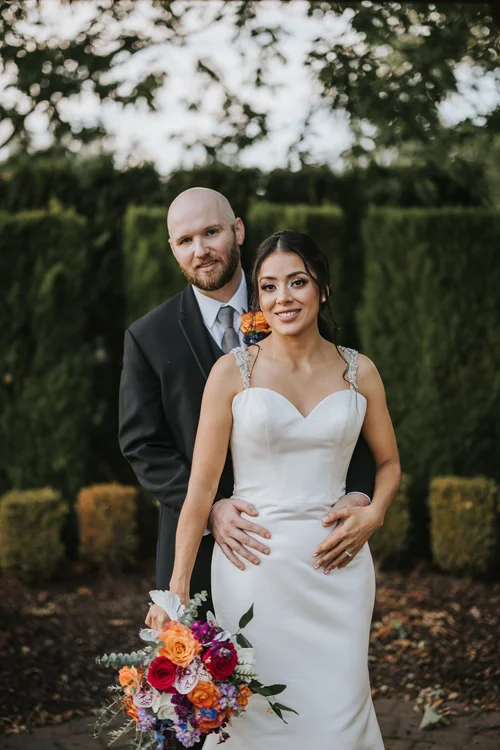 Couple sharing a quiet wedding moment outdoors